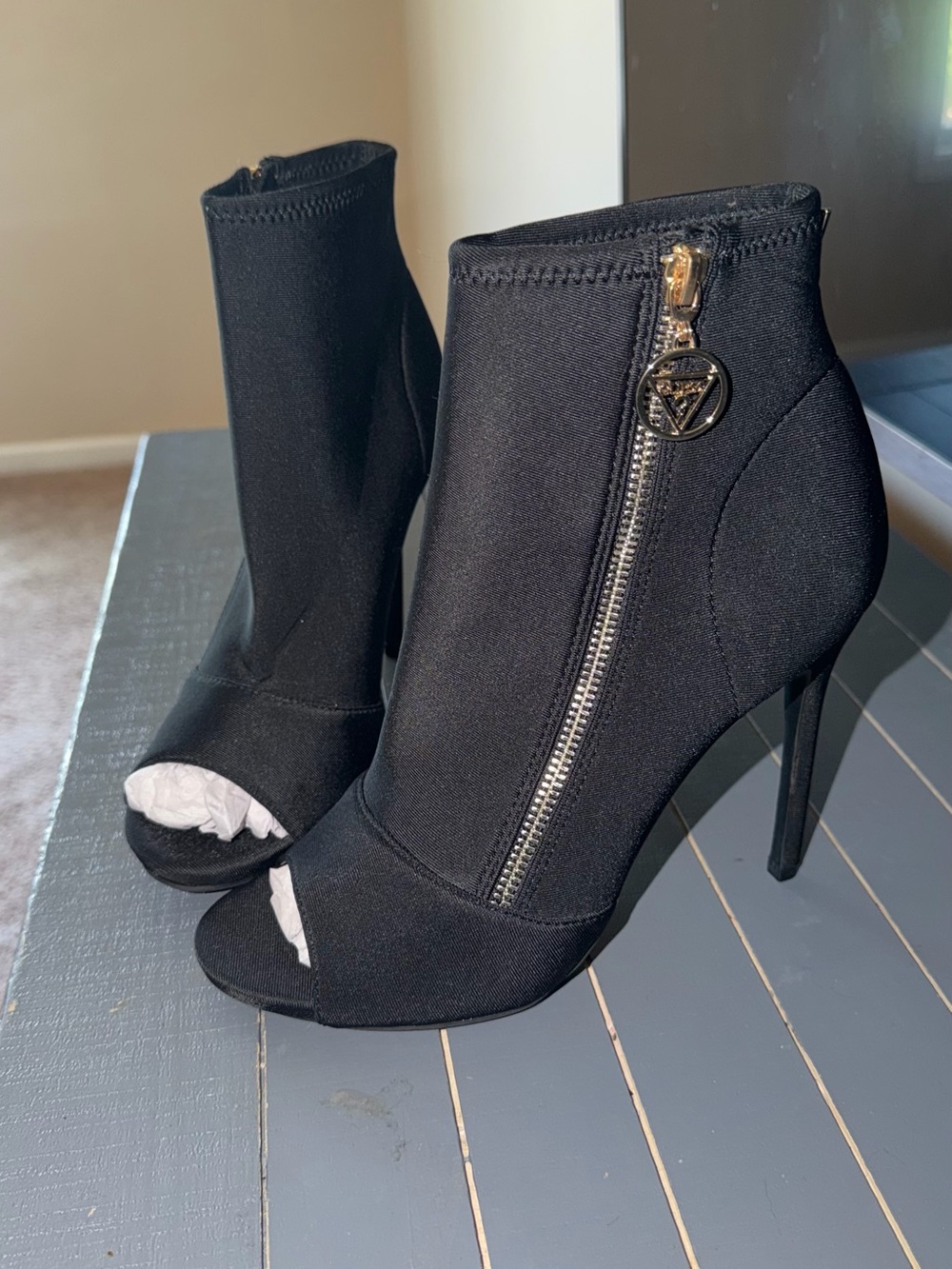 GUESS Black Peep-Toe Stiletto Ankle Boots with Gold Zip Charm